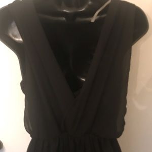 Woman’s black cocktail dress